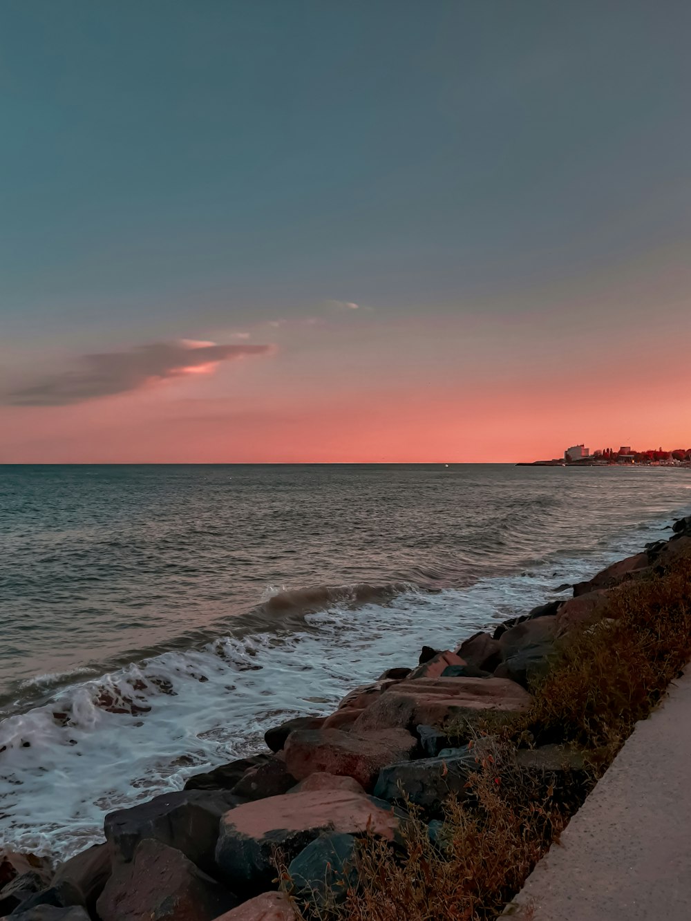 brown rocky shore during sunset