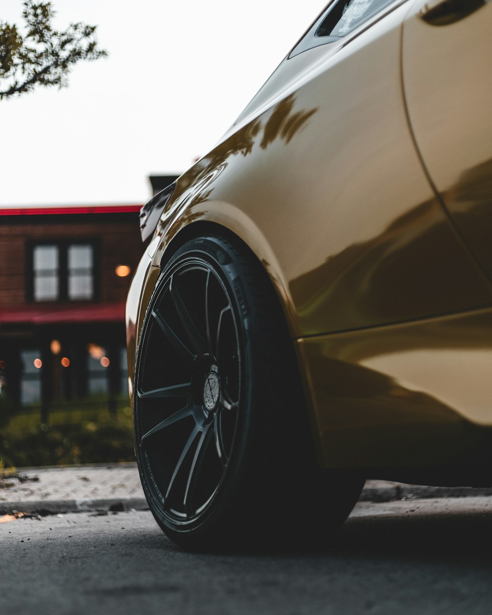 yellow car parked on the side of the road