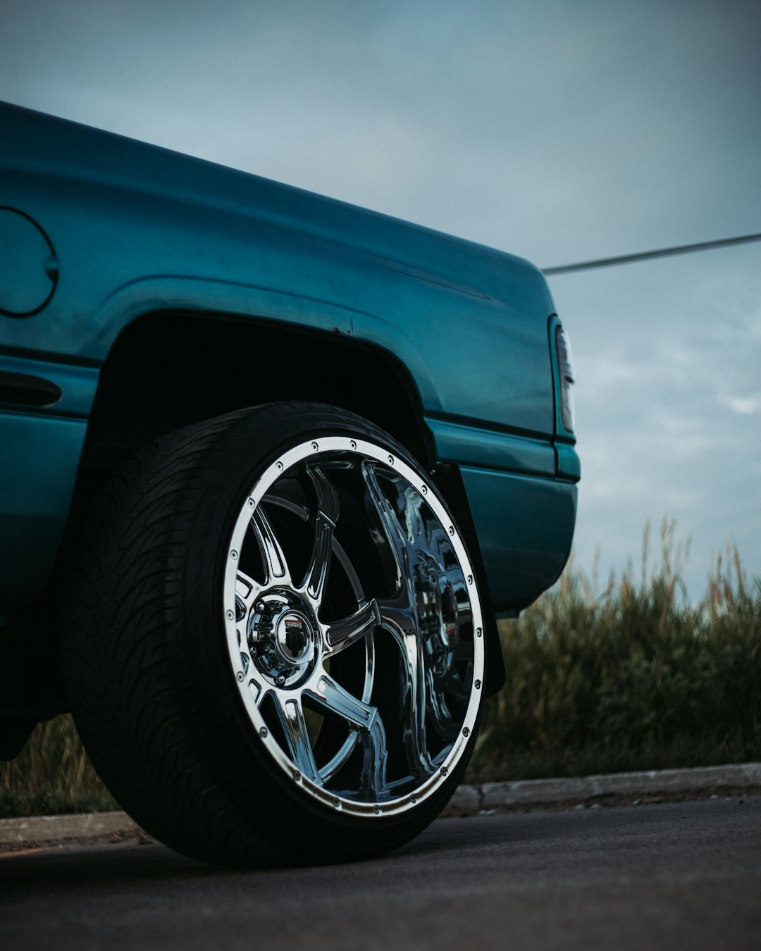 blue car with chrome wheel