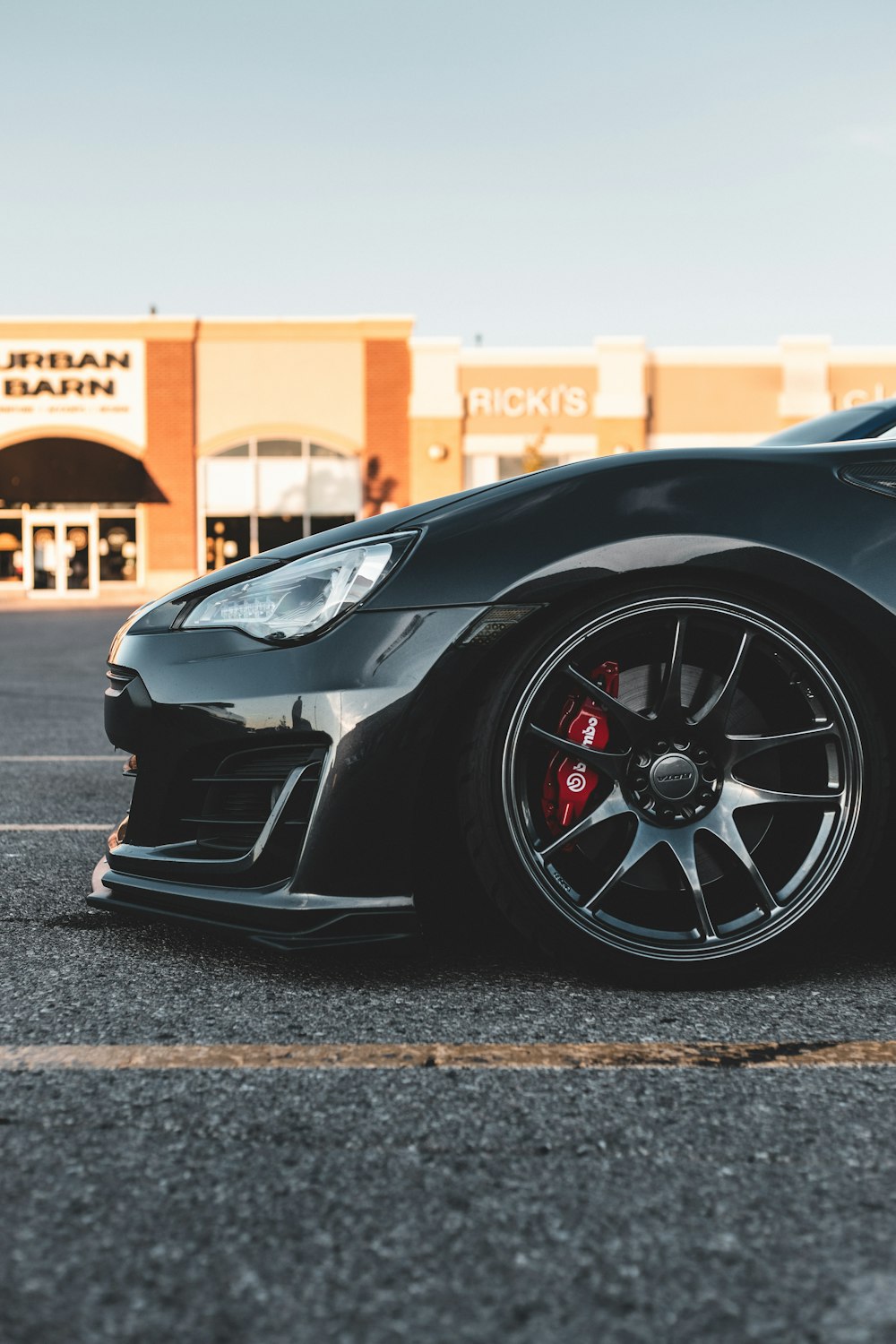 black ferrari 458 italia parked on road during daytime