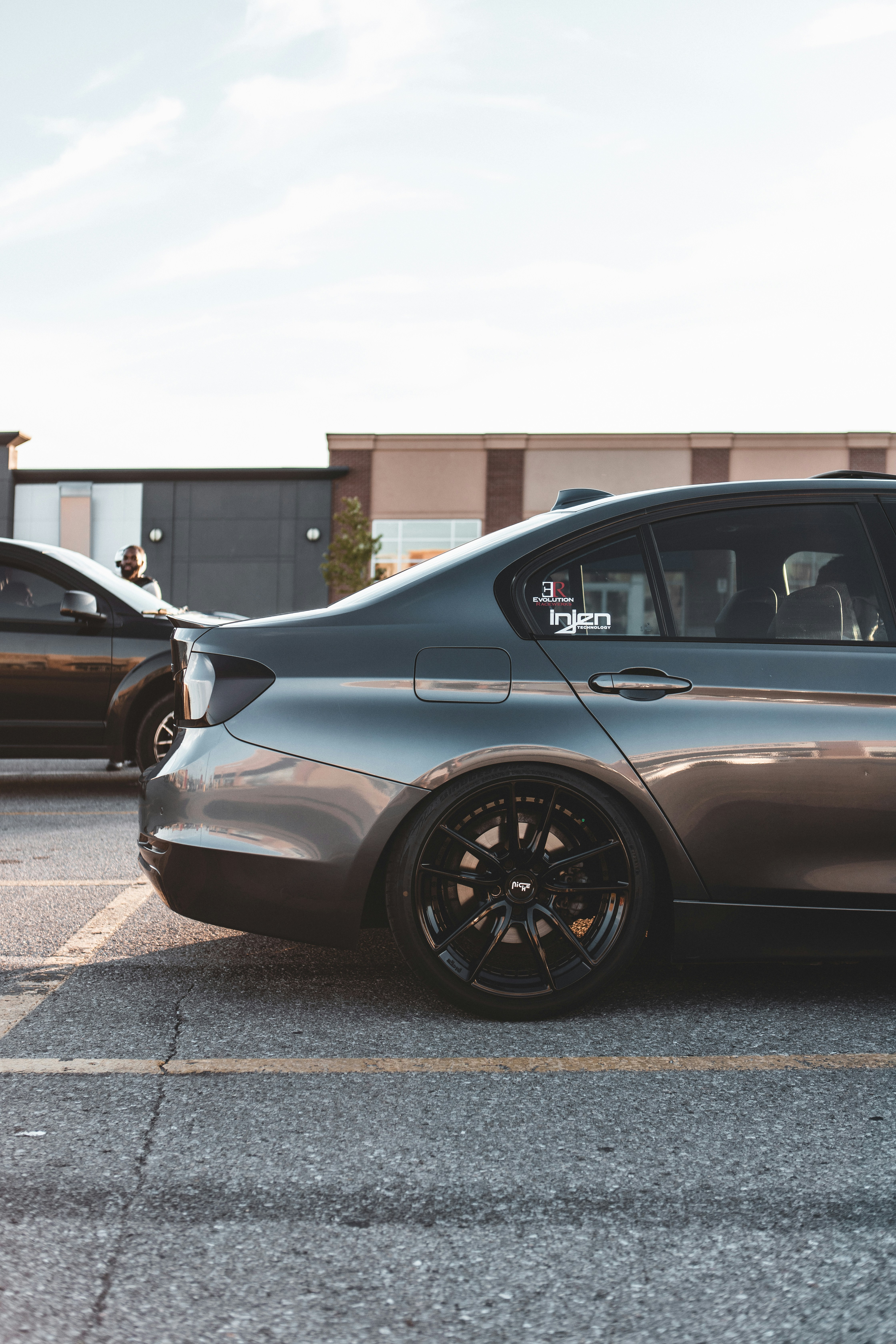 black car parked on the side of the road during daytime
