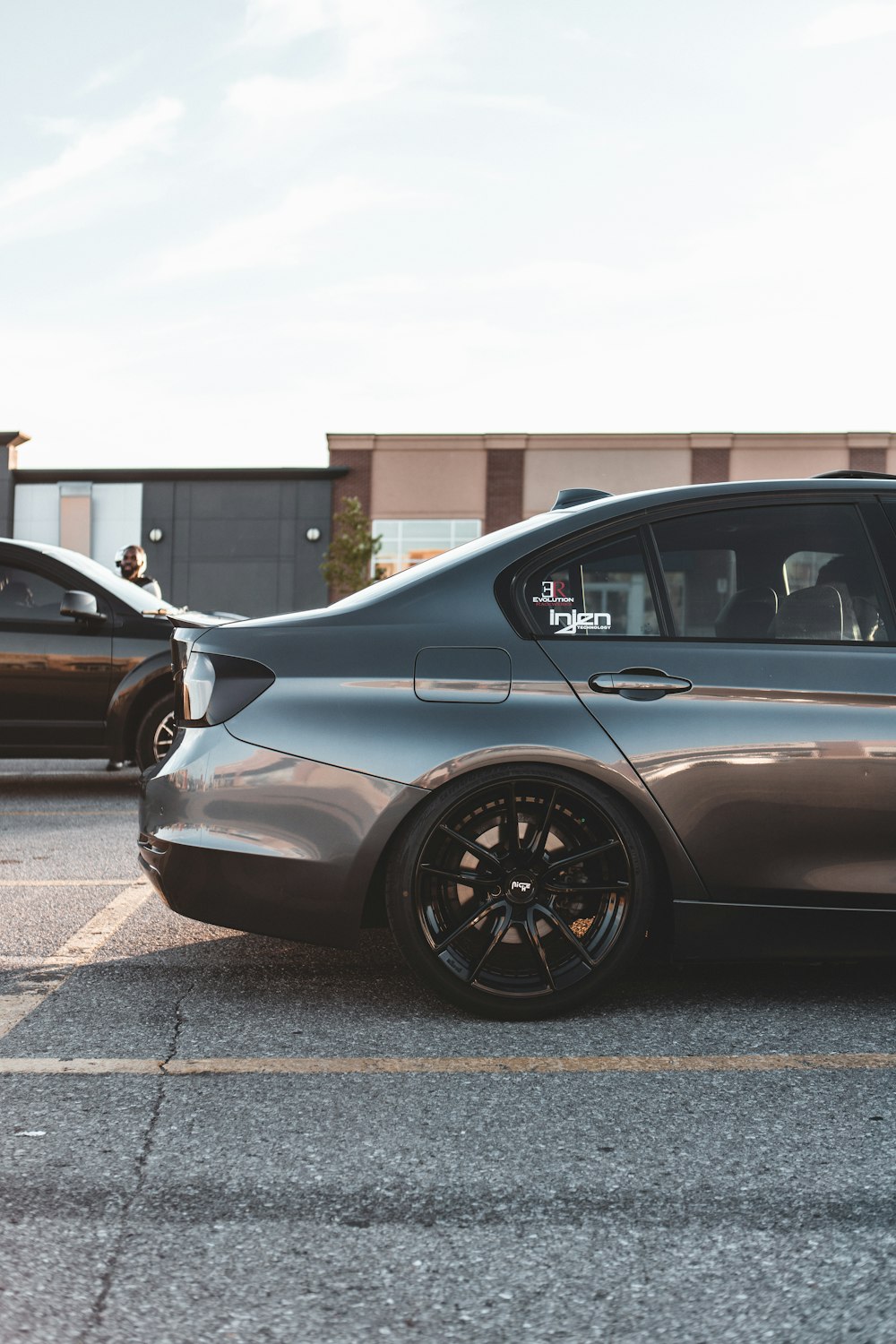 black car parked on the side of the road during daytime