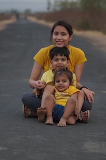 A family receiving support supplies with warm smiles, embodying dignity and hope.