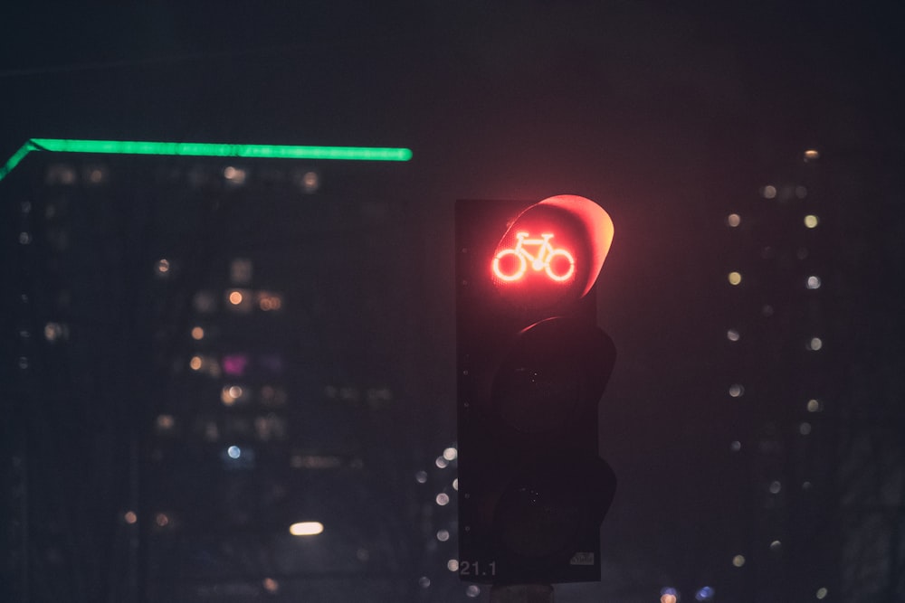 traffic light with red light during night time
