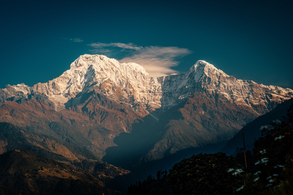 snow covered mountain under blue sky during daytime