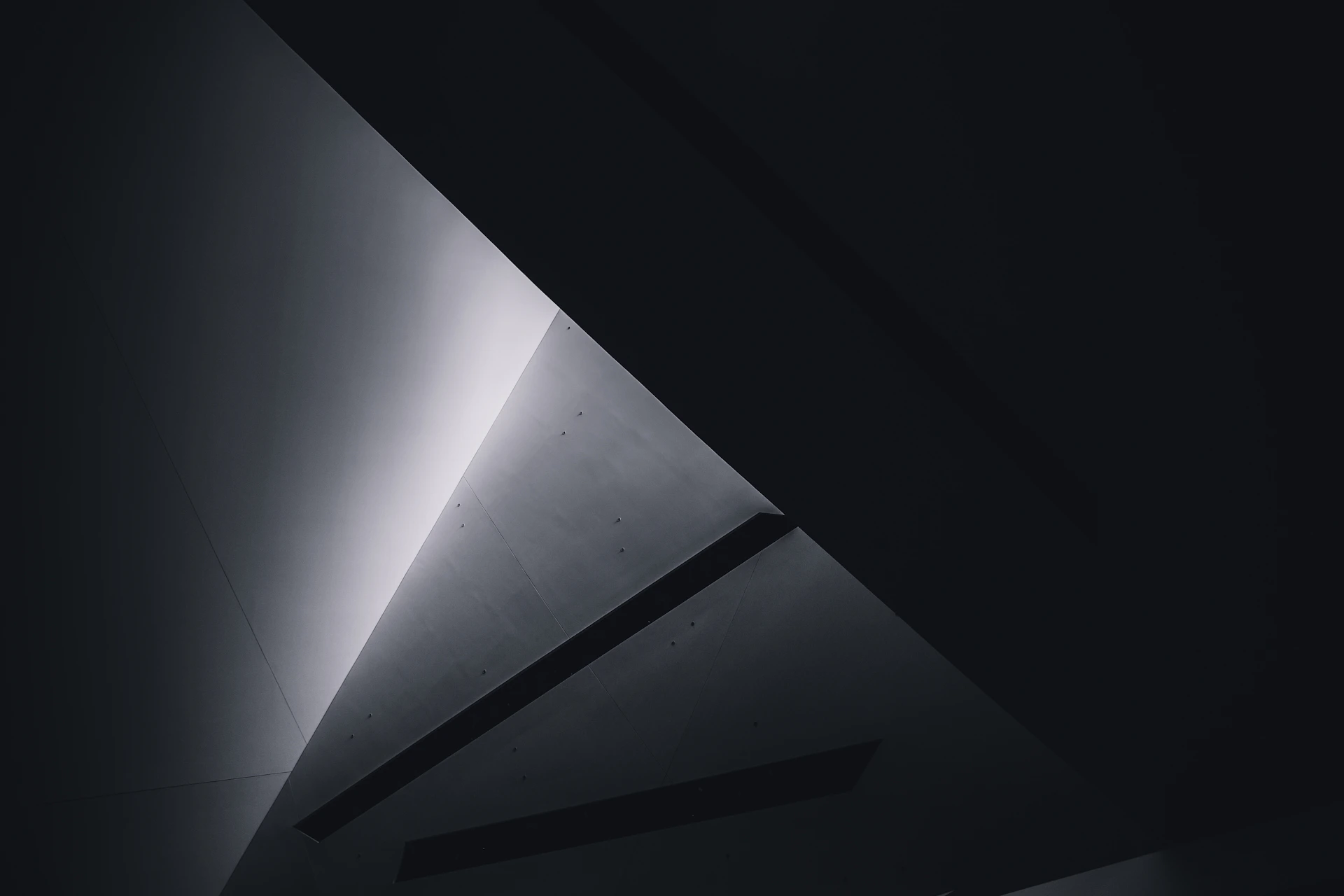 grayscale photo of a tunnel