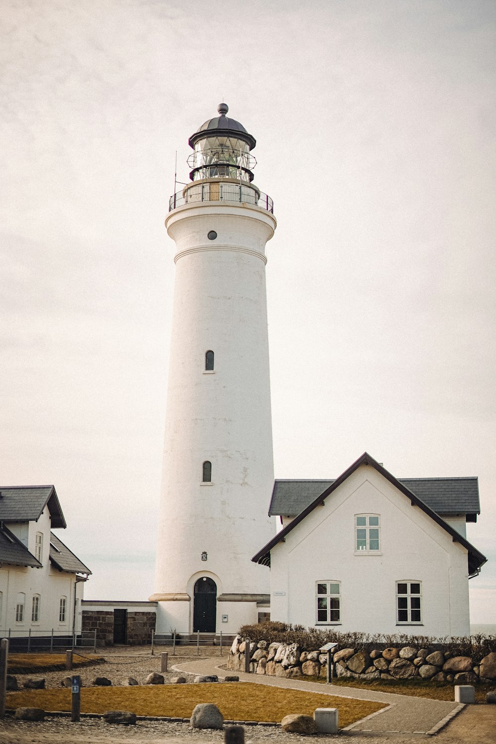 white and black lighthouse under white sky