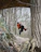 Two park rangers using Motorola T82 Extreme walkie talkies with a zipline backdrop.