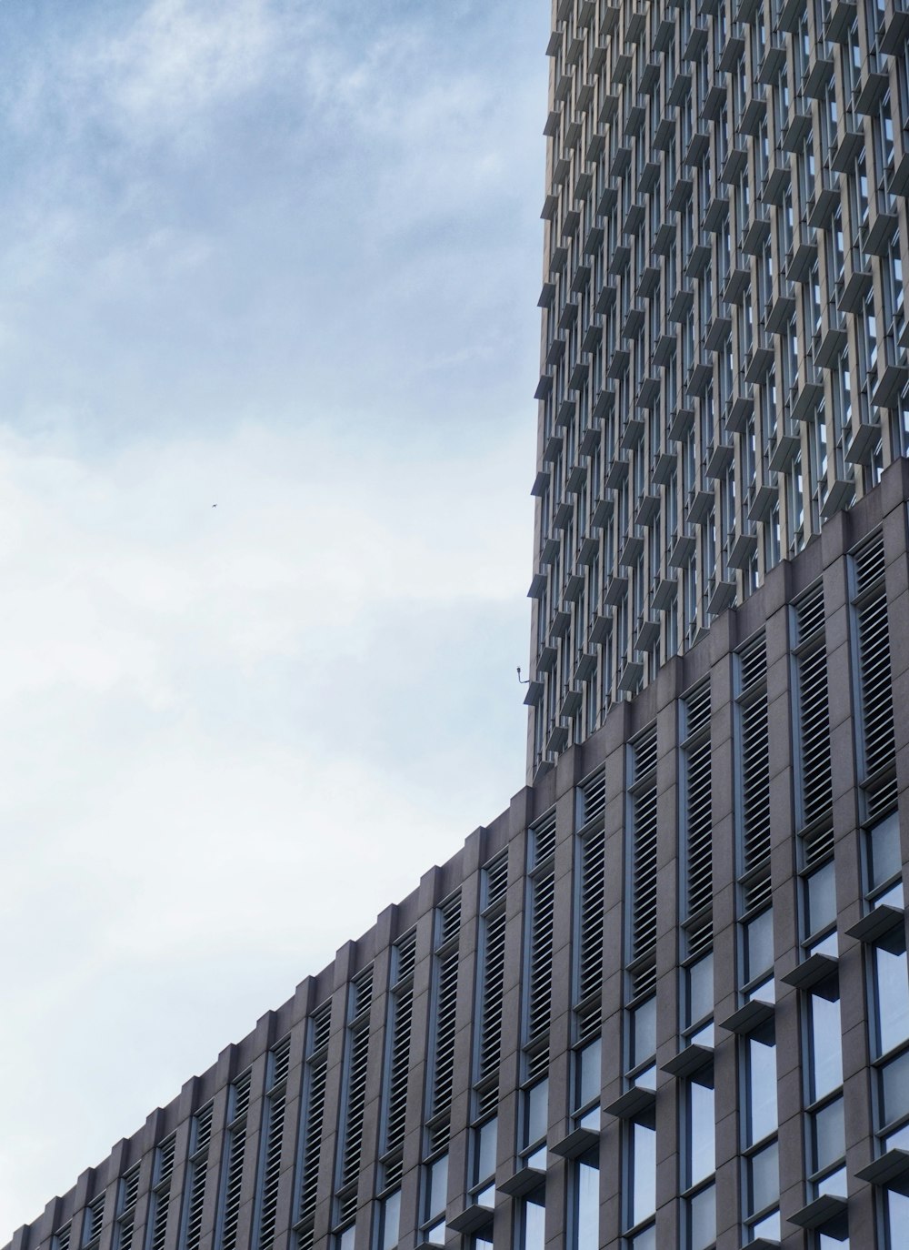 gray concrete building under white sky during daytime