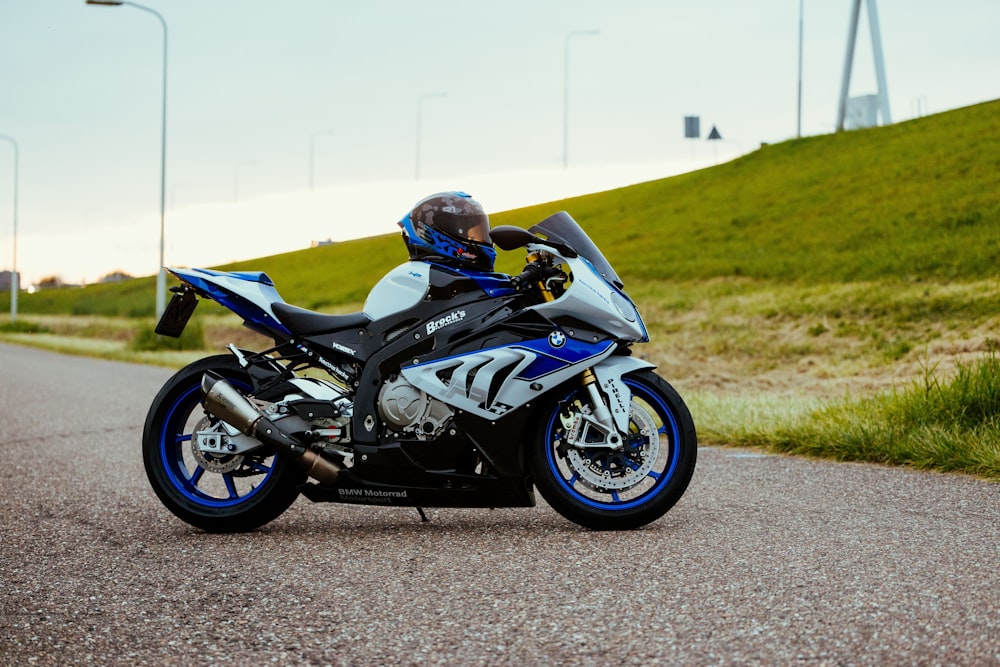 black and blue sports bike on road during daytime