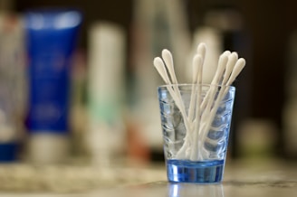 An assortment of sterile cotton swabs arranged neatly on a surface.