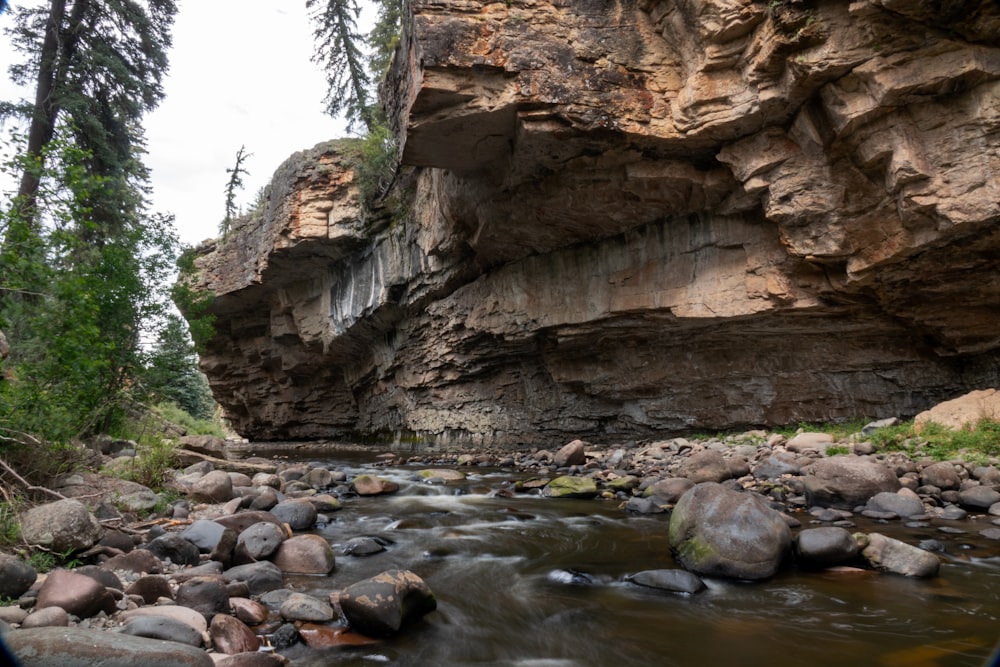 brown rocky mountain with river