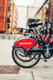 red and black bicycle on road during daytime