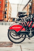 red and black bicycle on road during daytime