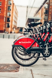 red and black bicycle on road during daytime