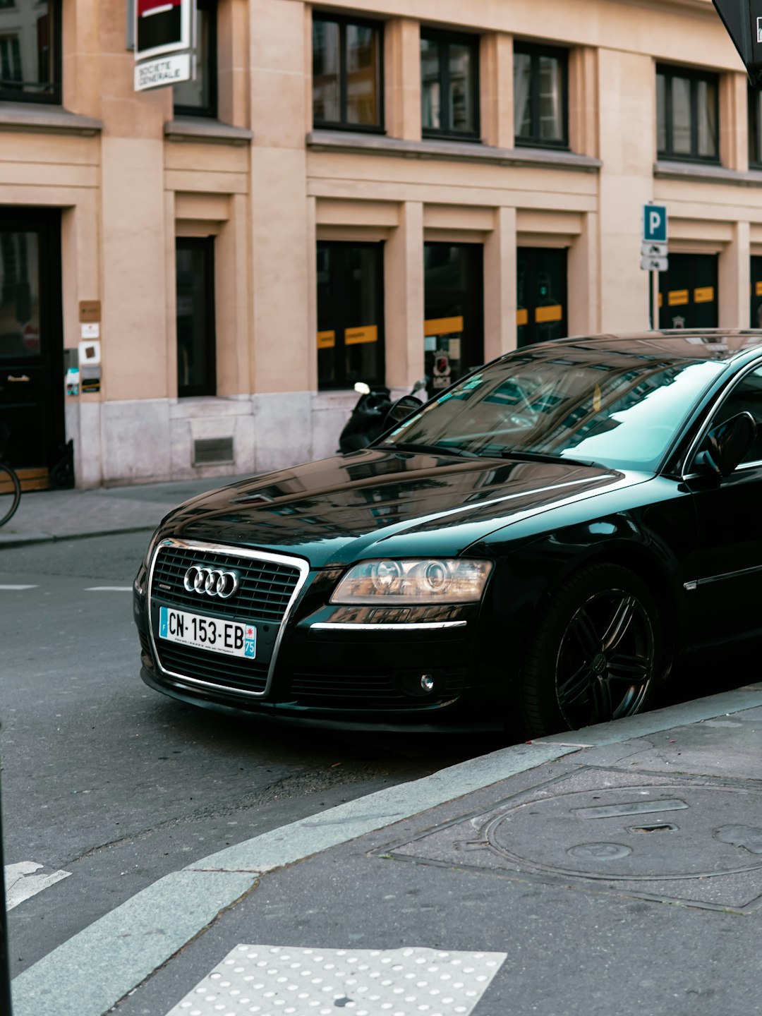 black audi a 4 sedan parked on the side of the road