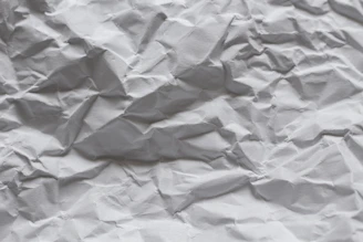 white paper on white textile