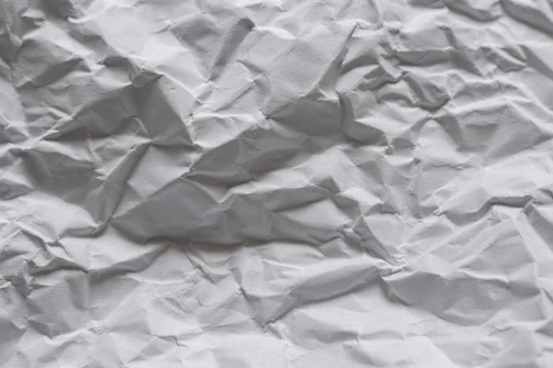 white paper on white textile