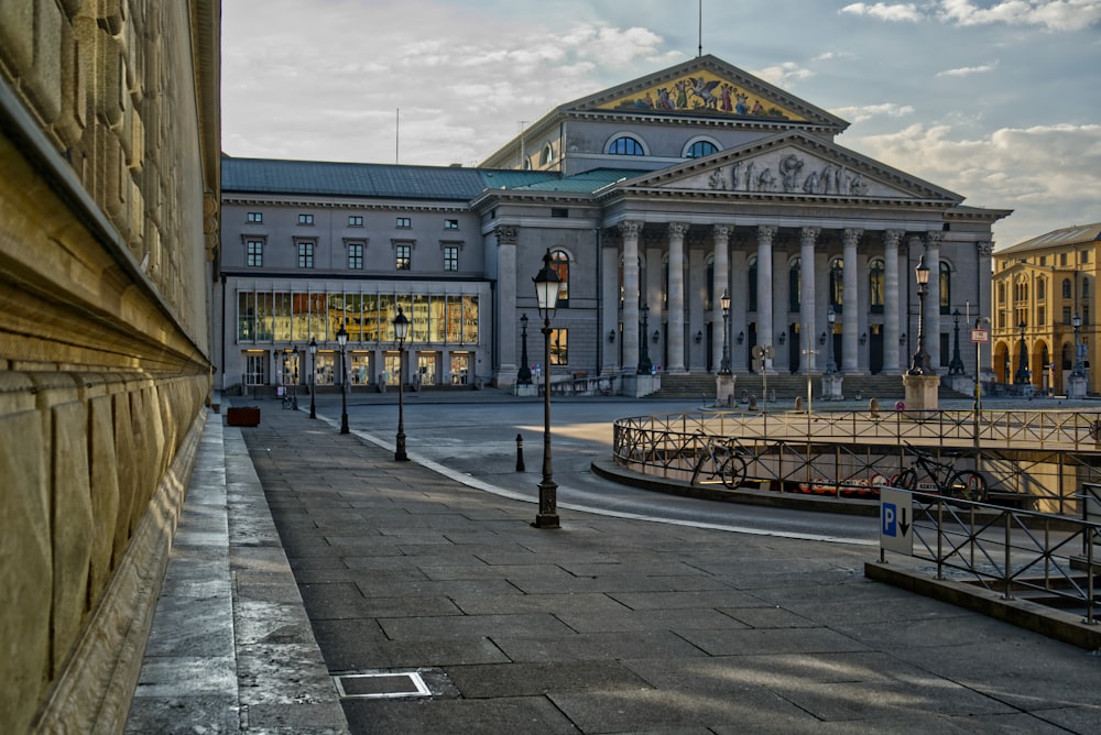 people walking on sidewalk near building during daytime