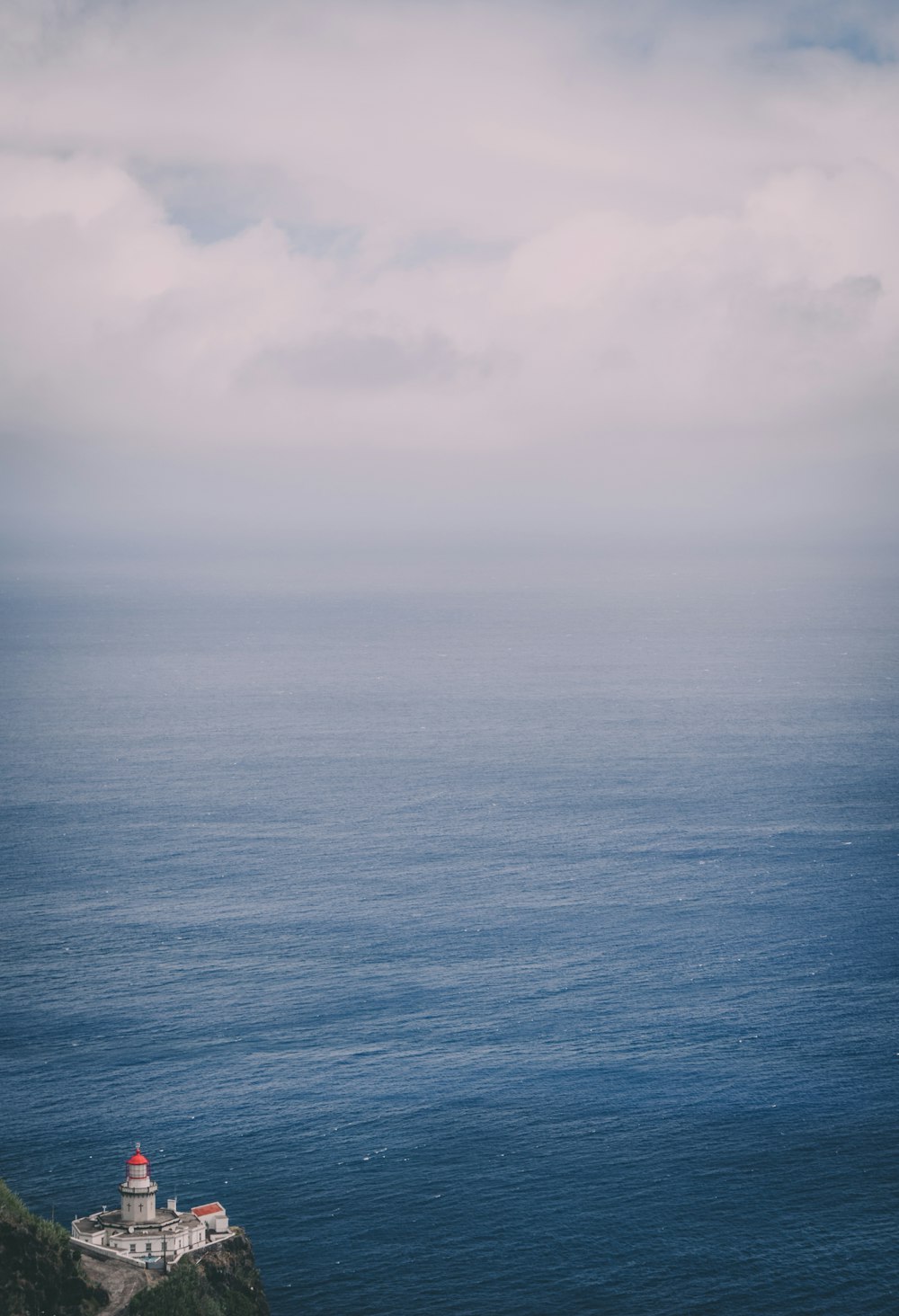 blue sea under white clouds during daytime