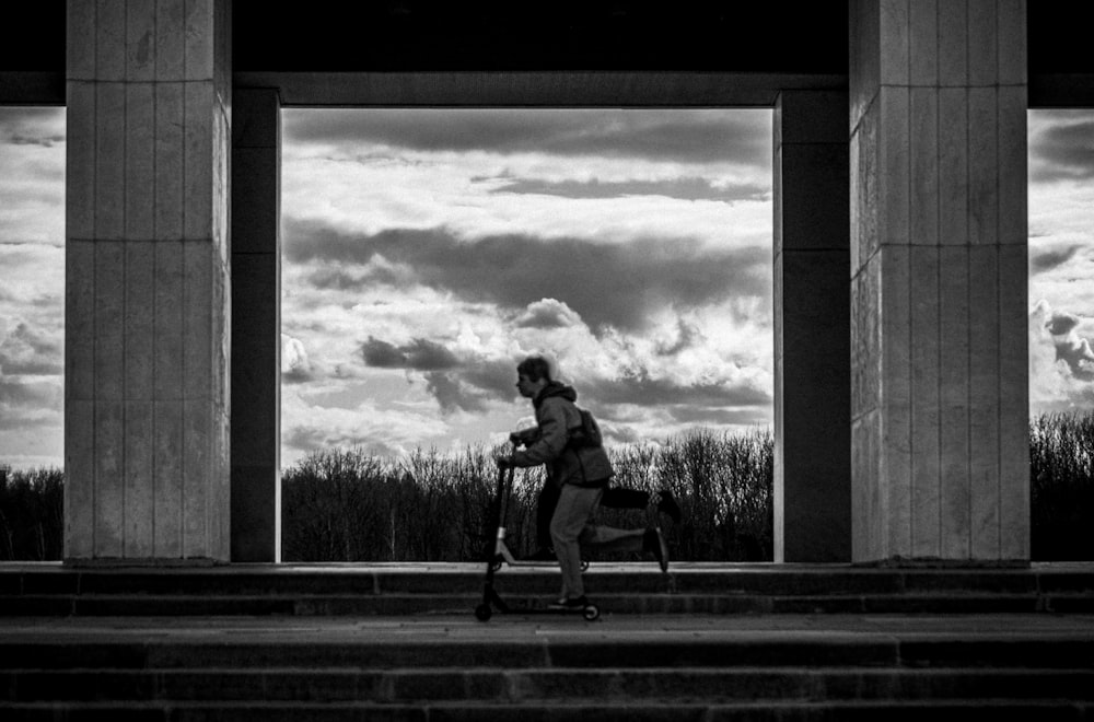 grayscale photo of man and woman kissing