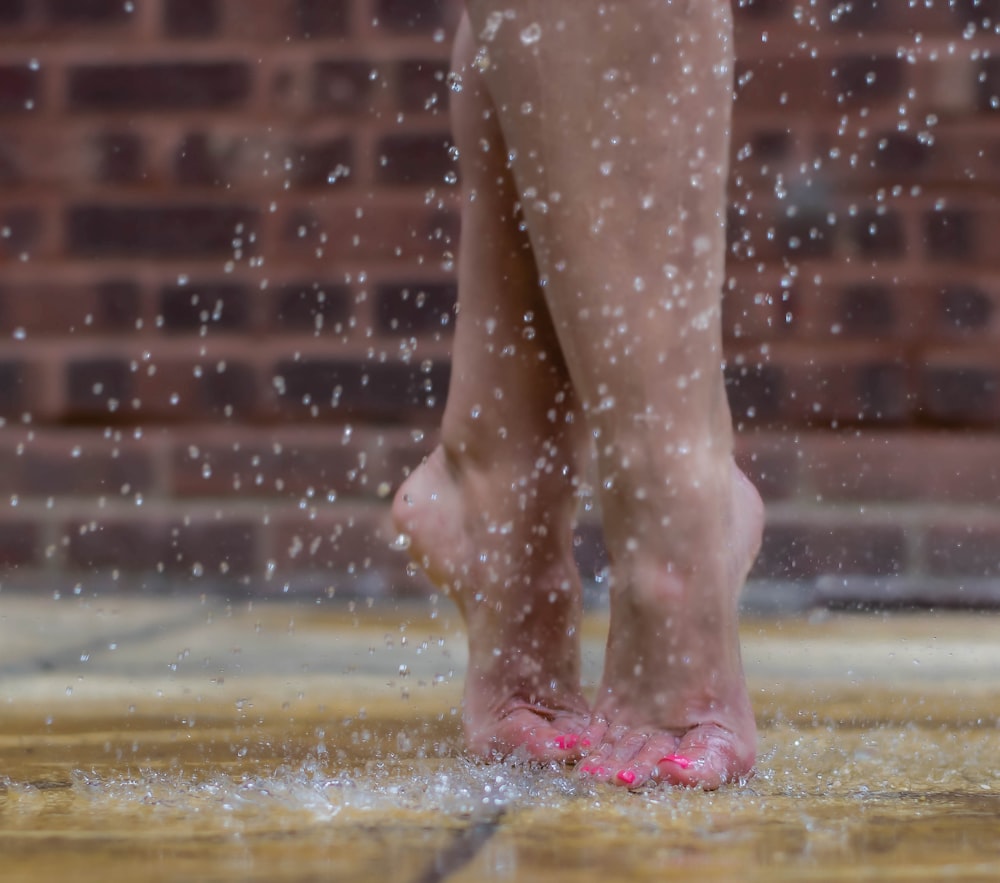 person standing on wet ground