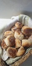 Display of freshly baked cookies and scones arranged invitingly on a wooden counter.