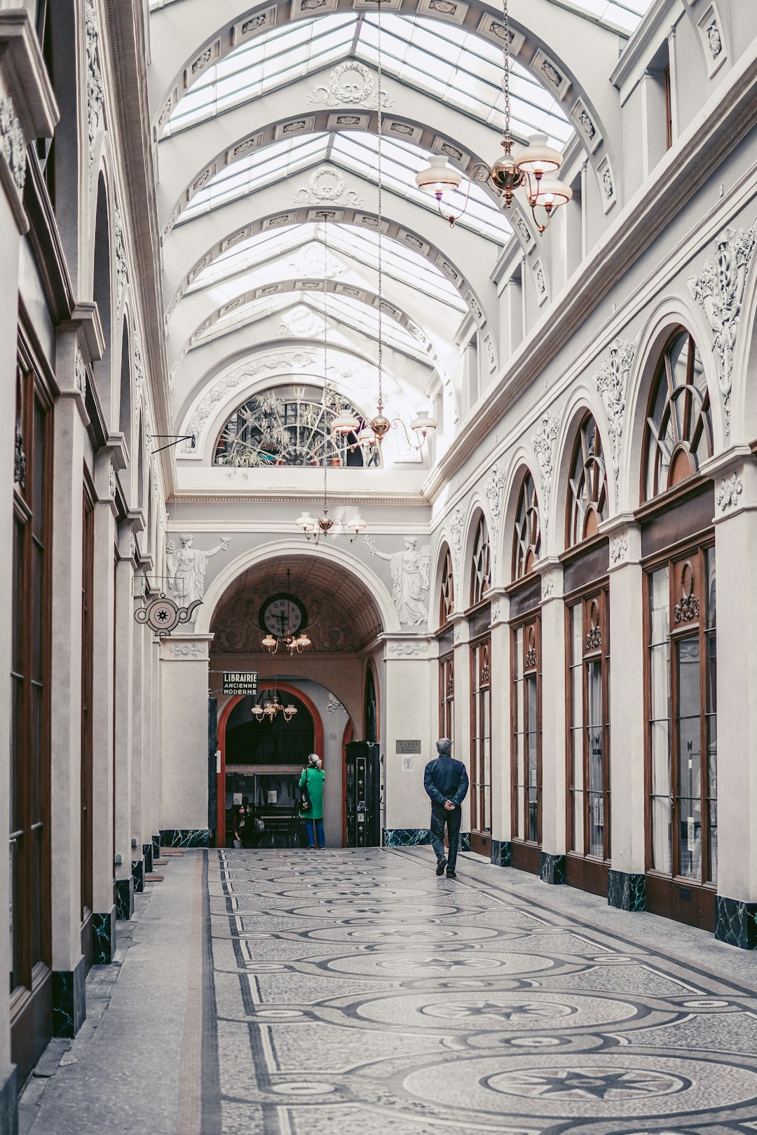 people walking on hallway of building