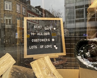 brown wooden signage on brown wooden plank