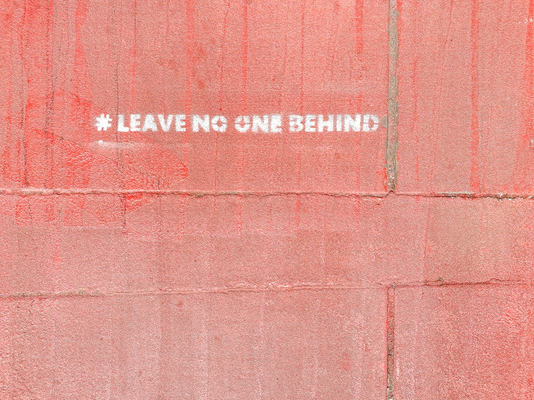 a red wall with a white sticker on it