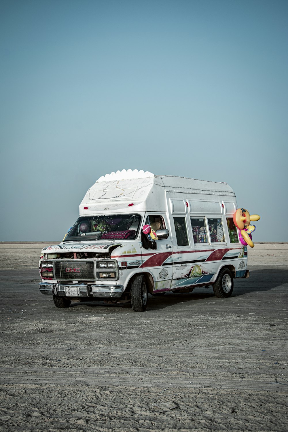 red and white van on road