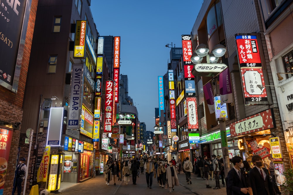 people walking on street during night time