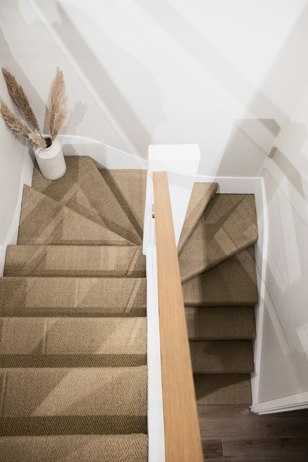 brown wooden stick on white textile