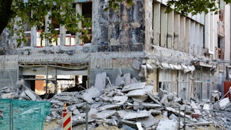 a building lies in ruins after an earthquake