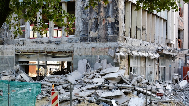 a building lies in ruins after an earthquake