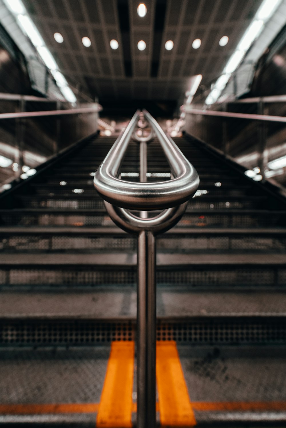 black and silver escalator in a train station