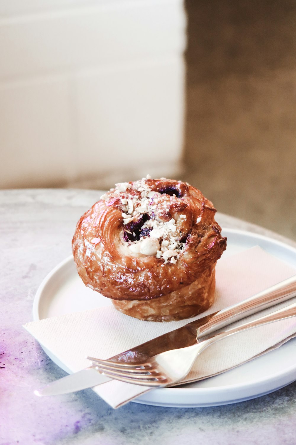 brown doughnut on white ceramic plate