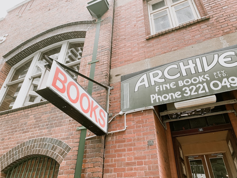 white and black wooden signage