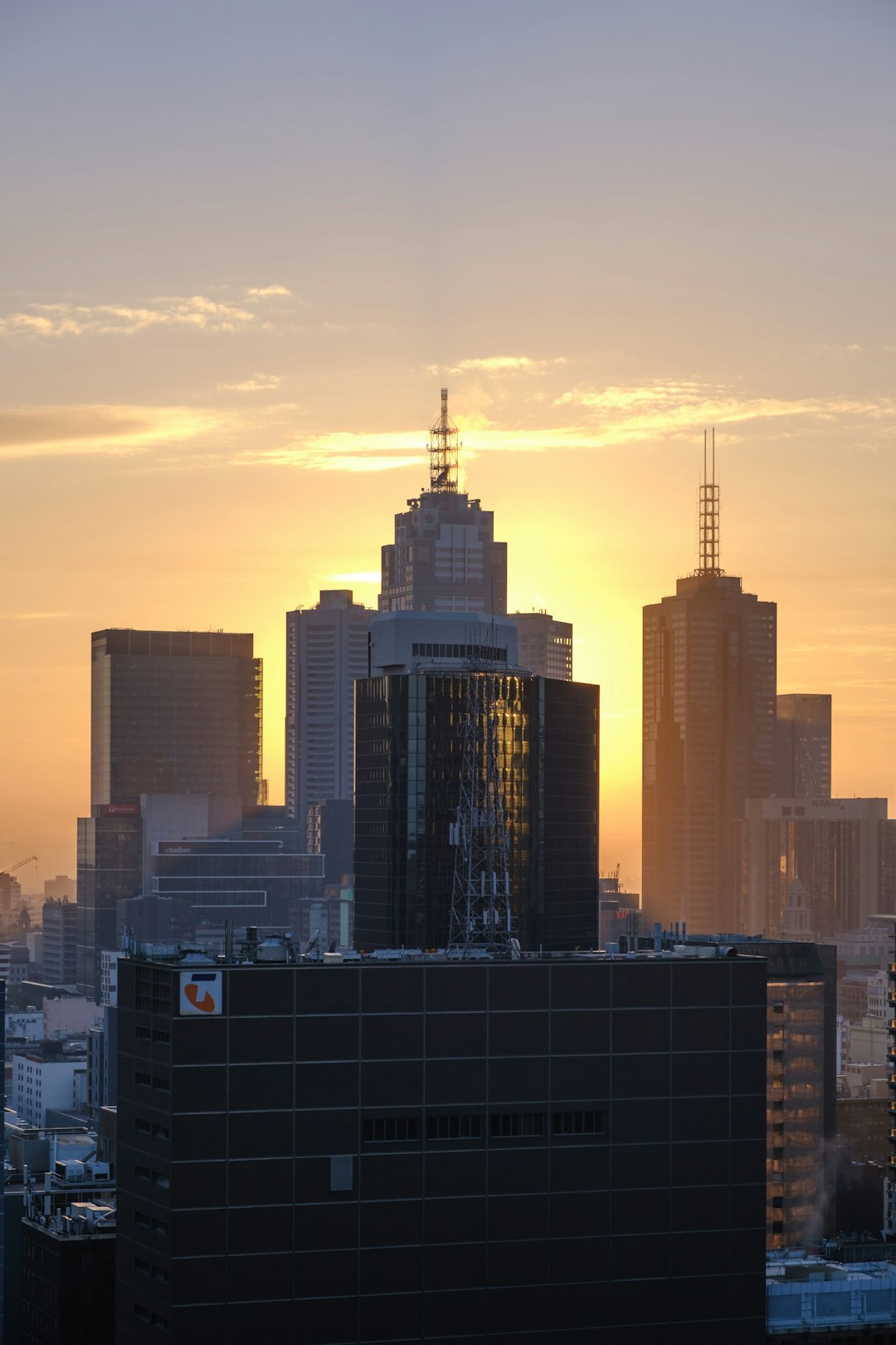 city skyline under white clouds during daytime