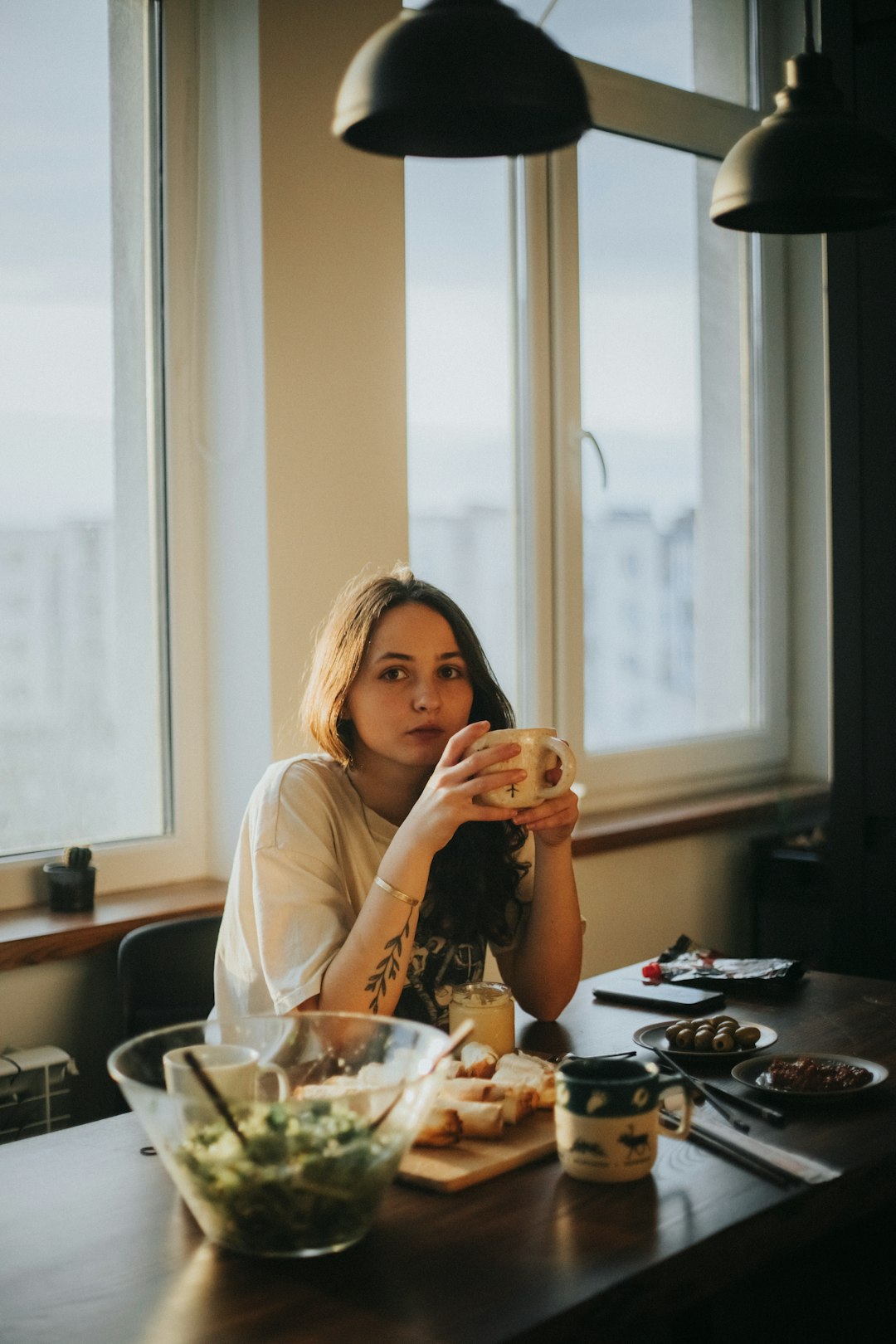 woman in white long sleeve shirt sitting on chair