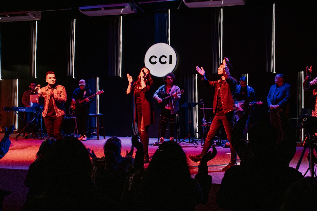 group of people standing on stage