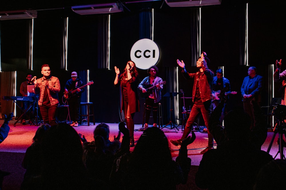 group of people standing on stage