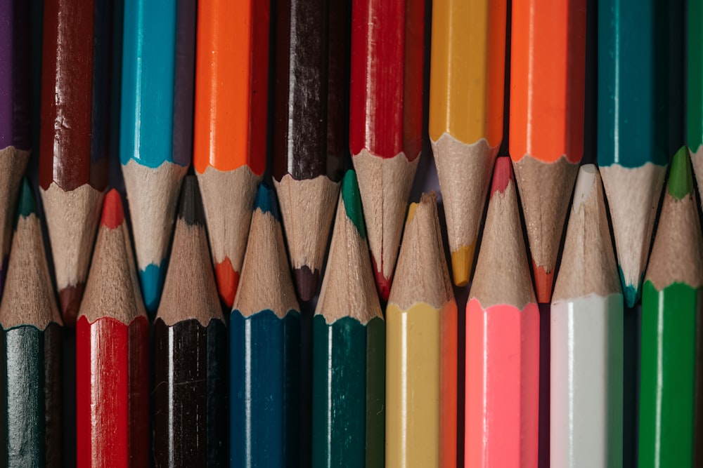multi color coloring pencils on brown wooden table