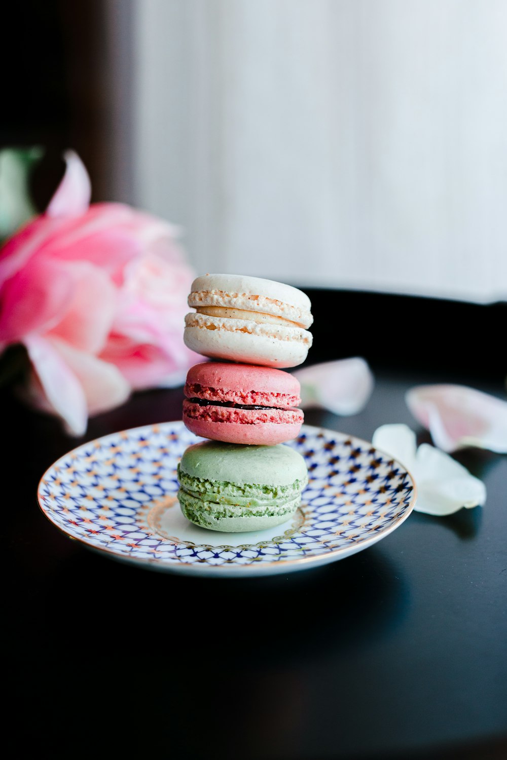 3 layered cookies on white ceramic plate