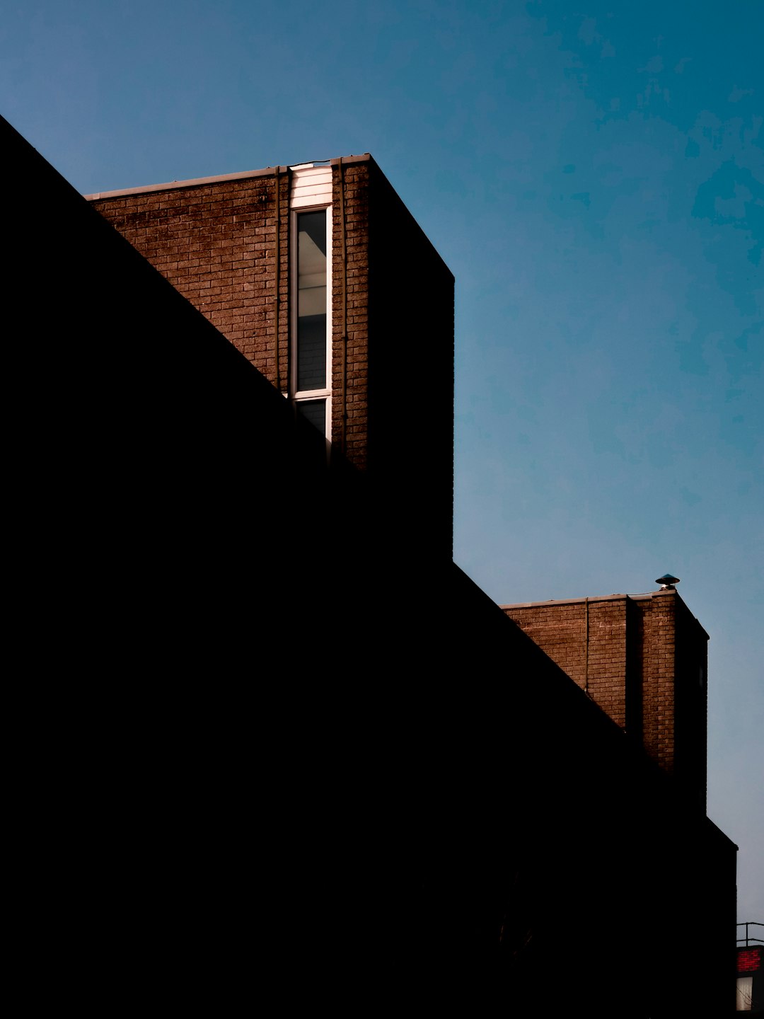 brown concrete building under blue sky during daytime