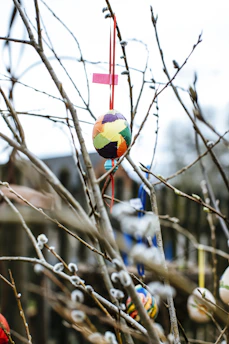 A vibrant Easter display with colorful eggs and ribbons in soft pastel tones, evoking a cheerful spring mood.