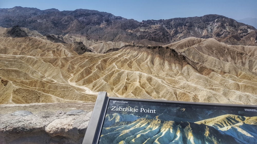 brown rocky mountain under blue sky during daytime