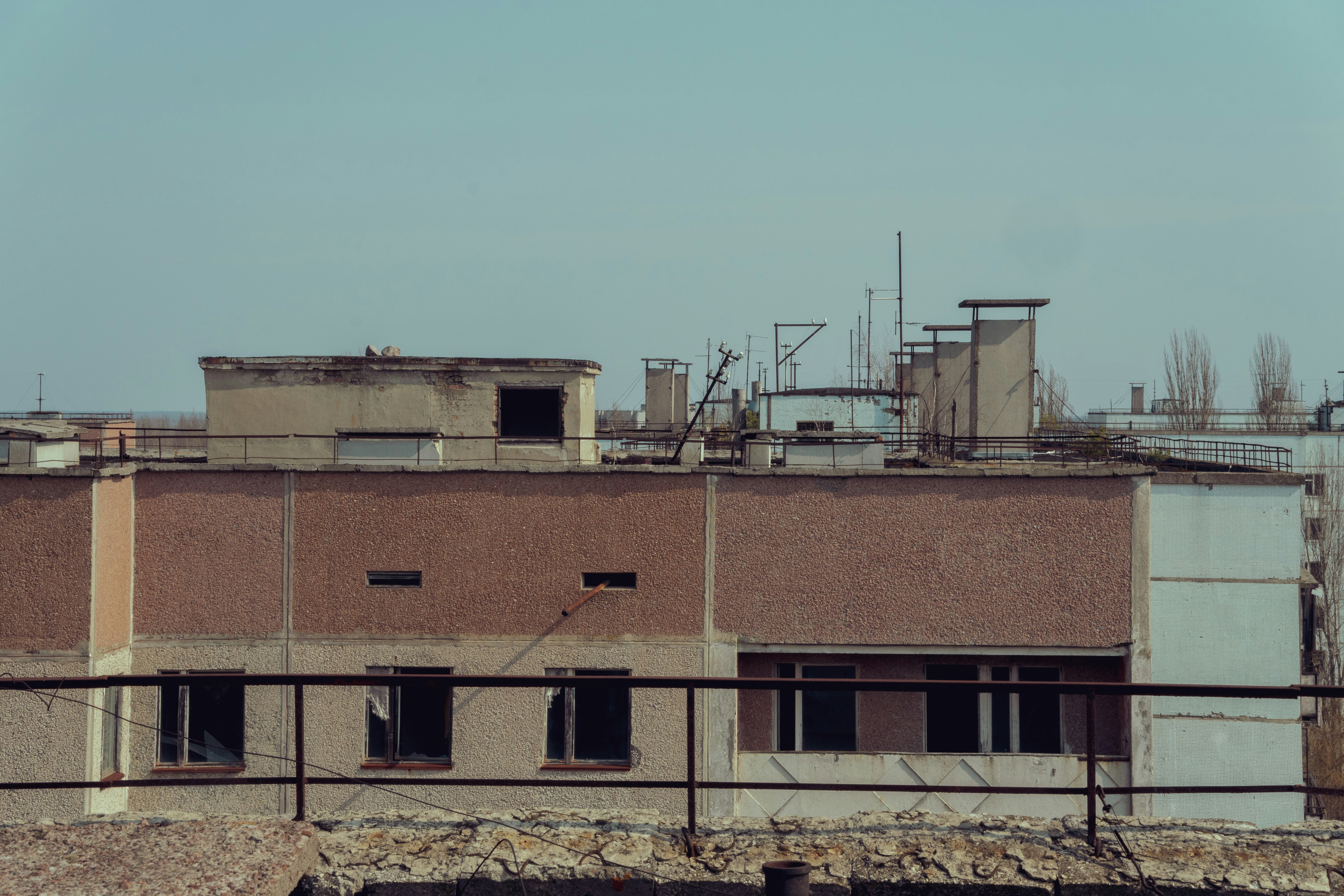 brown concrete building under blue sky during daytime