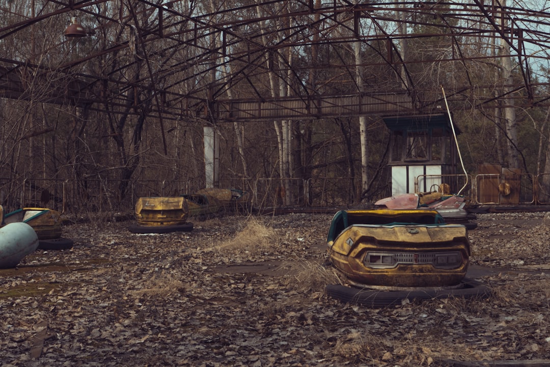 yellow car parked on brown dirt road,