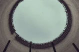 Close-up of skilled technicians assembling cooling tower components in a workshop.